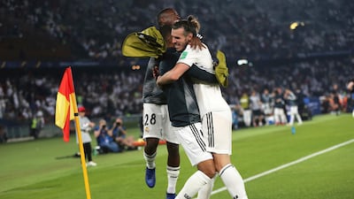 Real Madrid's midfielder Gareth Bale, right, celebrates with teammates after scoring his side's second goal. AP Photo