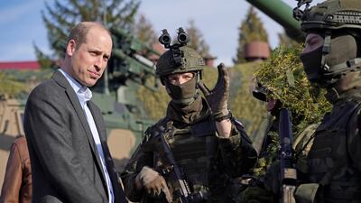 Prince William meets members of the Polish military. Getty