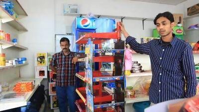 Business partners Mohamed Haneefa, left, and Naheef Murikkin Kattil say they cannot afford to pay between Dh200,000 and Dh300,000 to bring Abu Backar Grocery in line with the new regulations and both will now return to India. Ravindranath K / The National