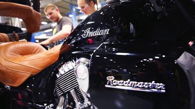 Workers put finishing touches on an Indian Roadmaster. The 'luxury touring model' of this motorcycle is decked out with modern features like anti-lock brakes, keyless ignition, electronic cruise control, a tire pressure monitoring system and a state of the art infotainment system. Scott Olson / Getty Images / AFP