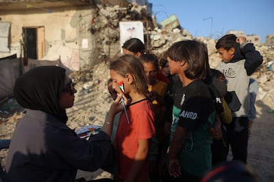 Children have their faces painted during the festival in Gaza city. AFP