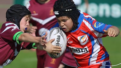Rugby coaches from the UAE and internationally are arguing against a suggested ban on tackling in school rugby. Delores Johnson / The National