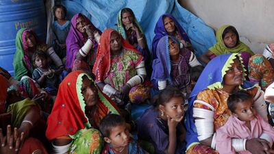 Women cotton pickers sit and listen during a leadership and advocacy skills workshop organized by the Sindh Community Foundation (SCF), in Meeran Pur village, north of Karachi. Akhtar Soomro / REUTERS