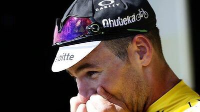 Team Dimension Data rider Mark Cavendish of Britain celebrates on the podium wearing the overall leader’s yellow jersey following the first stage of the 103rd Tour de France first stage of the Tour de France cycling race from Mont Saint-Michel to Utah Beach, France, Saturday, July 2, 2016. Sebastien Nogier / EPA