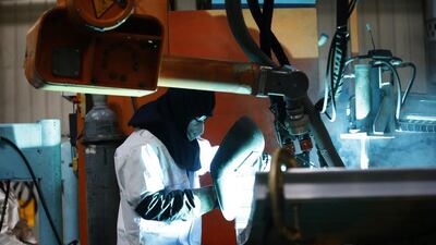 An employee works on a production line of parts for CRH380B, a high speed train model of Tangshan Railway Vehicle’s factory. Kim Kyung-Hoon / Reuters