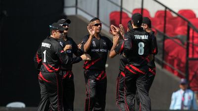 Hong Kong cricketer Nadeem Ahmed (C) celebrates the wicket of Zimbabwe’s Richmond Mutumbami during the opening match of the T20 Cricket World Cup in the Indian town of Nagpur on March 8, 2016. AFP
