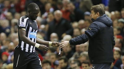 Moussa Sissoko hands Newcastle United manager John Carver his captain's armband as he leaves the pitch after being sent off in the club's 2-0 loss to Liverpool on Monday. Lee Smith Action Images / Reuters / April 13, 2015
