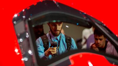 People look at the new mid-engine 2020 Corvette Stingray at the Next Generation Corvette Reveal event in Irvine, California. AFP