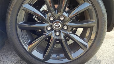 The Mazda3's 18-inch gloss-black rims are encased within low-profile Bridgestone 215/45R18 tyres.