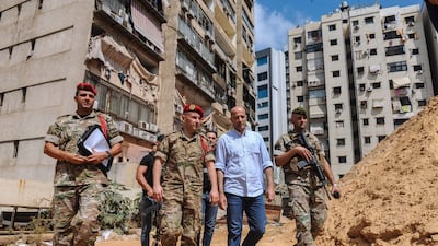 Investigators from Lebanon's military intelligence inspect a site after an attack by two Israeli drones in Dahieh, Beirut. EPA