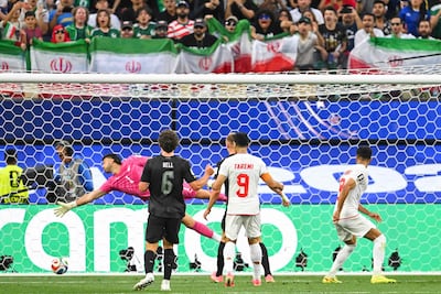 Iran's midfielder Mohammad Mohebbi scores his team's second goal past New Zealand. AFP