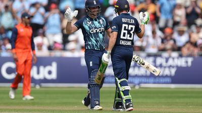 Liam Livingstone, left, and Jos Buttler of England celebrate as they finish the innings and set a new record in 50-over cricket - 498-4 during the first ODI against Netherlands. Getty Images
