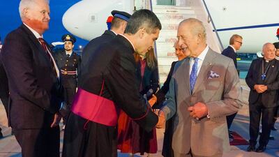 Monsignor Javier Gonzalez, the head of the Vatican's Protocol Office, greets King Charles. Getty Images