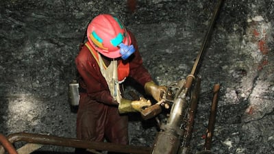 A miner at the South Deep gold mine south of Johannesburg. South Africa’s mines have gone so deep that companies are turning to robots and drones to carry out the work in conditions too deep and dangerous for humans – which affects the labour market. Themba Hadebe / AP Photo