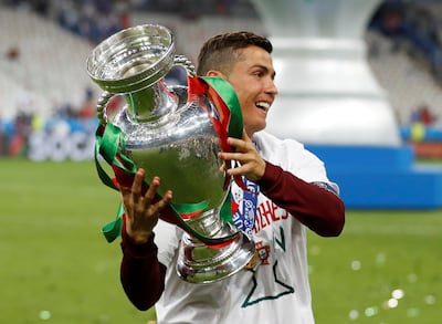 Portugal's Cristiano Ronaldo celebrates with the trophy after winning Euro 2016. Reuters