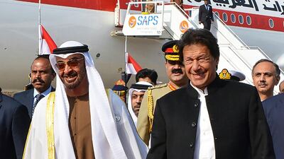 Imran Khan walks with Sheikh Mohamed bin Zayed upon his arrival at the military Nur Khan Air Force base in Islamabad. AFP