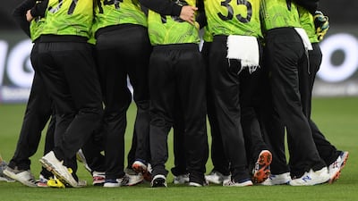 Australia players celebrate after clinching victory over India. Getty