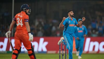 India's Mohammed Siraj celebrates the wicket of Netherlands' Wesley Barresi, left. AP