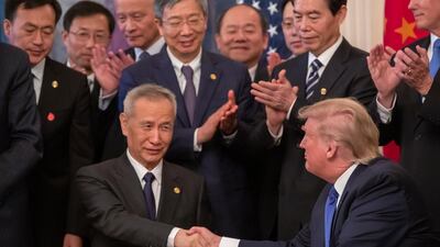 US President Donald Trump and Chinese Vice Premier Liu He participate in a signing ceremony in the East Room of the White Houseon Wednesday. EPA