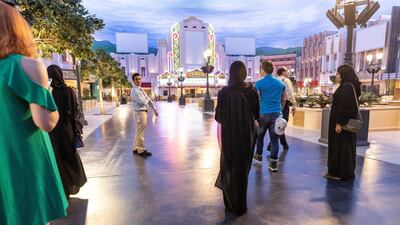 An array of sights greet the park's first guests as they walk up Warner Bros Plaza. Antonie Robertson / The National