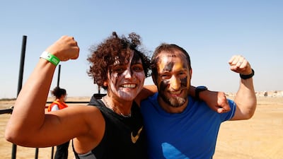 Jubilant competitors reflect the Tough Mudder aim of challenging yourself while having fun, at O West district, in Giza, Egypt. Reuters
