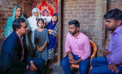 The Burjeel Holdings team with the family of Abdul Rasheed at their home in Kopaganj, Uttar Pradesh. Photo: Burjeel Holdings