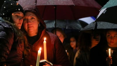 Lizzie and Kathy Varda take part in a vigil led by the Junior Newtown Action Alliance to mourn students and teachers lost in a mass shooting in Florida's Stoneman Douglas High School. Michelle McLoughlin / Reuters