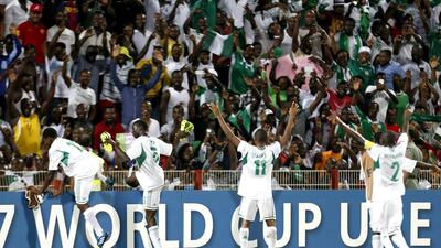 Nigerian team players celebrate their 3-0 win over Sweden following the two teams' semi-final in the FIFA U-17 World Cup in Dubai's Rashid Stadium on Wednesday. Nigeria will meet Mexico in the finals on Friday in Abu Dhabi. Karim Sahib / AFP