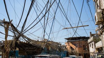 Electricity cables hang over the streets of Burj Barajneh refugee camp, in Beirut, Lebanon. Andrew McConnell for The National