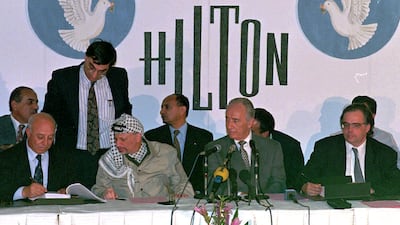 PLO chairman Yasser Arafat and Israeli foreign minister Shimon Peres at the Hilton hotel in Taba, Egypt, September 1995. AP Photo