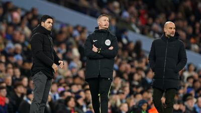 Arsenal's Spanish manager Mikel Arteta and his Manchester City countryman Pep Guardiola during the FA Cup fourth-round match at Etihad Stadium on January 27, 2023. PA