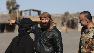 Ahmad Al Odeh, centre, had refused to merge his Eighth Brigade militia with the new Syrian government's army. AFP
