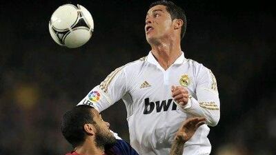 Cristiano Ronaldo, right, the Real Madrid player, has scored 41 league goals so far this season, but so has Barca's Lionel Messi. Lluis Gene / AFP