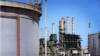 Refining towers and storage tanks idled during the uprising. Bloomberg News