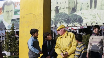 Zakkour chats with children in the central square