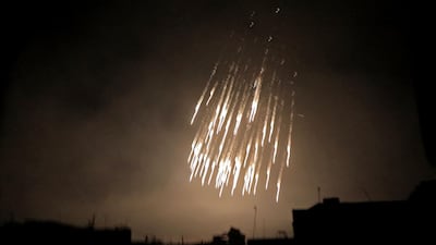 A picture taken early on March 23, 2018 shows what appear to be white phosphorus incendiaries landing during regime bombardment in Douma, one of the few remaining rebel-held pockets in Eastern Ghouta on the outskirts of the capital Damascus. Hamza Al Ajweh / AFP