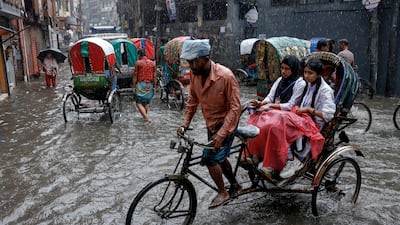 Flooded streets in heavy rain in Dhaka, Bangladesh. Reuters