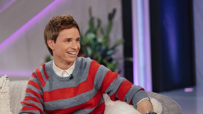 British actor Eddie Redmayne wears bold coloured stripes with a classic white shirt. Getty Images