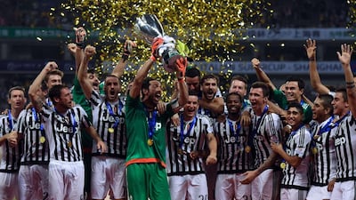 Juventus players celebrate after winning the Italian Super Cup against Lazio in Shanghai earlier this month. The club are looking for their fifth straight scudetto in 2015/16. Johannes Eisele / AFP / August 8, 2015