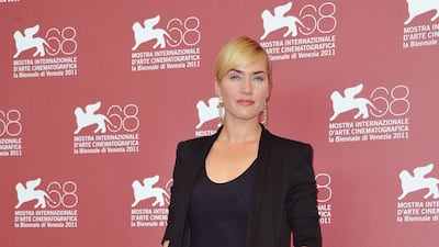 Kate Winslet, in a black shorts suit, attends a 'Mildred Pierce' photo call at the Palazzo del Cinema during the 68th Venice Film Festival on September 2, 2011, in Venice, Italy. Getty Images