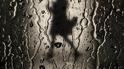 A woman walks with an umbrella in the rain, in Pamplona, Spain. Ivan Aguinaga / EPA