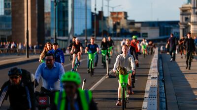 Commuters cycle across London Bridge during a strike by Tube workers in London. Bloomberg