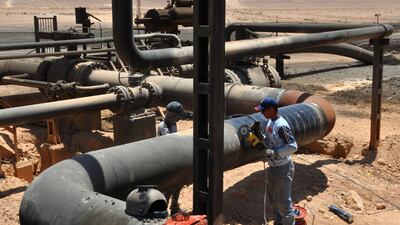 Workers at Syria's Arak gasfield this month, after it was retaken by government forces from the hands of ISIL. AFP