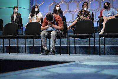 12-year-old Vikram Raju from Denver, Colorado takes a moment to himself during the final round of the Scripps National Spelling Bee at the Gaylord National Harbor Resort in Oxon Hill, Maryland. AFP