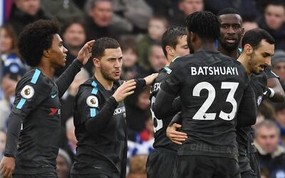 Chelsea's Eden Hazard, second left, celebrates with teammates after scoring his second goal during the English Premier League match against Brighton & Hove Albion. Andy Rain / EPA