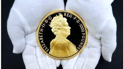 A gold coin commemorating the 60th anniversary of the coronation of Britain's Queen Elizabeth II. Luke MacGregor / Reuters