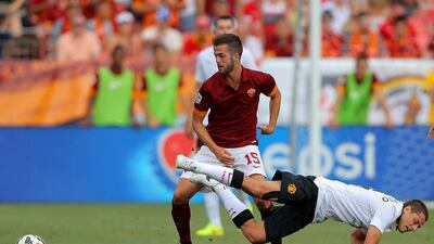 Miralem Pjanic, left, of AS Roma takes the ball away from Javier Hernandez, right, of Manchester United during their International Champions Cup match on Saturday in Denver, US. Justin Edmonds / Getty Images / AFP