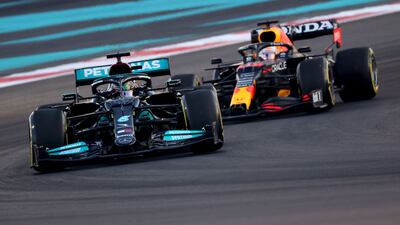 Mercedes' Lewis Hamilton drives ahead of Red Bull's Max Verstappen at the Yas Marina Circuit during the second free practice session of the Abu Dhabi Formula One Grand Prix. AFP