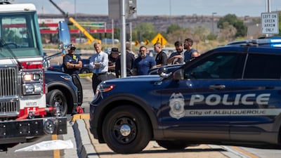 Albuquerque mayor Tim Keller, second from left, is briefed by officials at the site of a fatal balloon crash in Albuquerque, New Mexico. AP Photo
