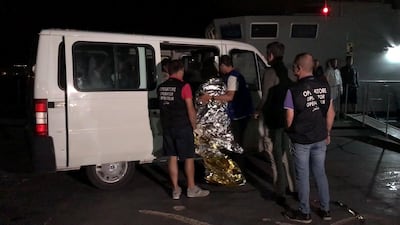 Survivors rescued by the Italian coastguard after their ship carrying some 50 migrants began taking on water, are brought to safety at the port of Lampedusa, Italy October 7, 2019. REUTERS/Mauro Buccarello
